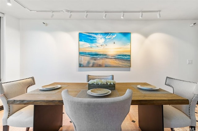 dining space with light hardwood / wood-style flooring