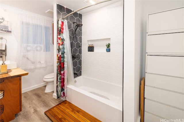 full bathroom with shower / bathtub combination with curtain, toilet, vanity, and wood-type flooring