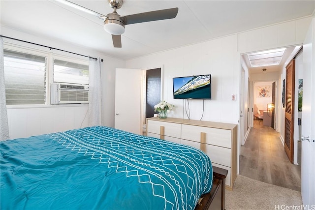 bedroom featuring cooling unit and ceiling fan