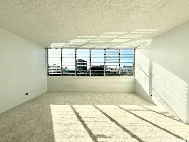 spare room featuring a textured ceiling