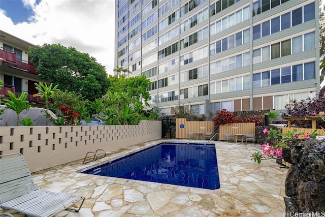 view of swimming pool featuring a patio