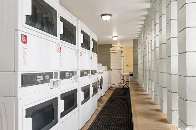 hall featuring stacked washer and dryer and washing machine and clothes dryer