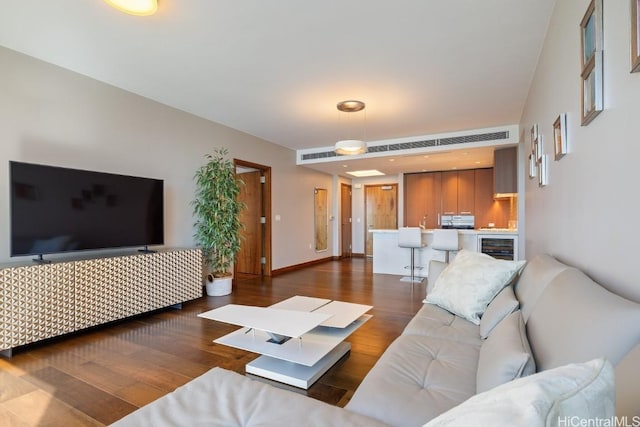 living room with beverage cooler and dark hardwood / wood-style flooring