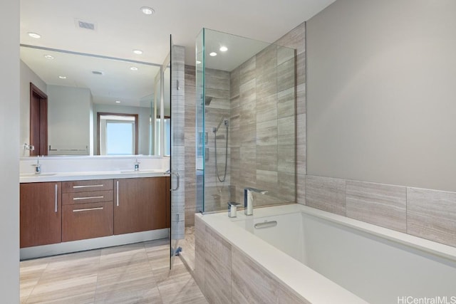 bathroom featuring vanity, separate shower and tub, and tile patterned flooring