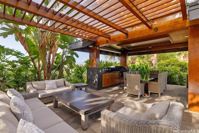 view of patio featuring exterior kitchen, area for grilling, an outdoor hangout area, and a pergola