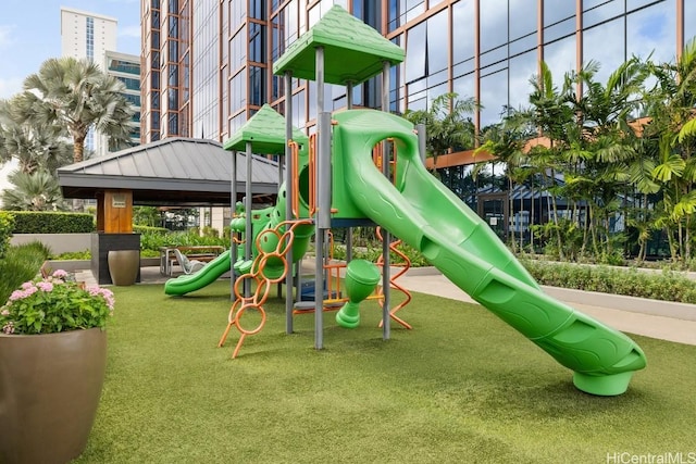 view of playground with a yard