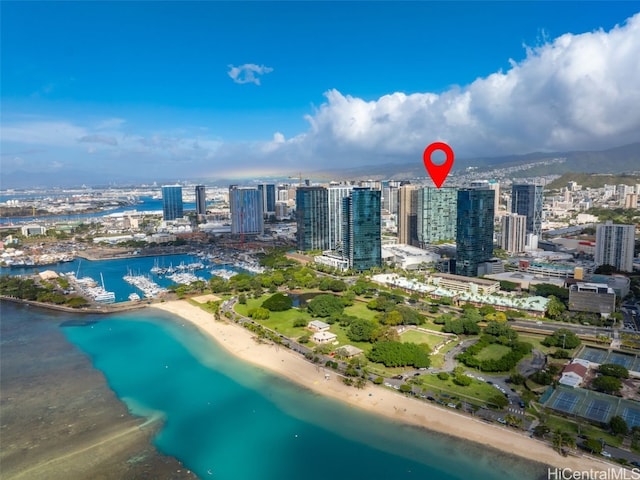 bird's eye view featuring a water view and a view of the beach