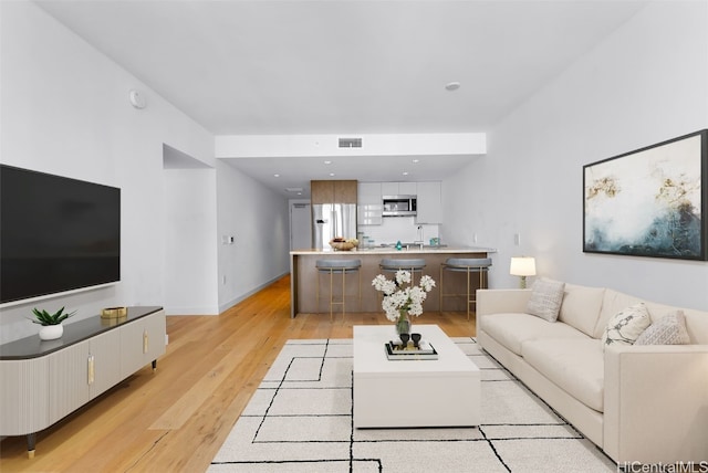 living room with light wood-type flooring