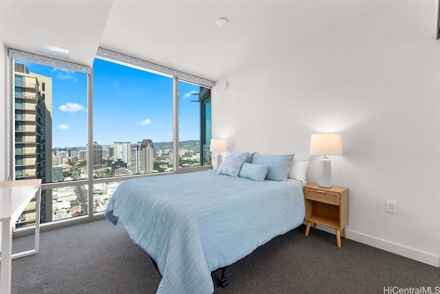 carpeted bedroom featuring expansive windows