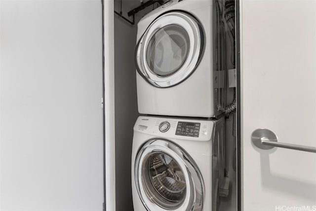 laundry area with stacked washer and dryer