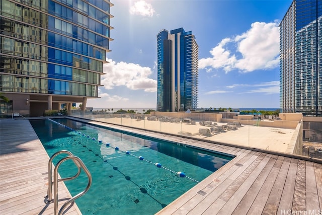 view of swimming pool with a patio