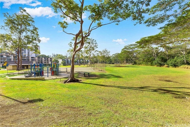 view of jungle gym featuring a lawn