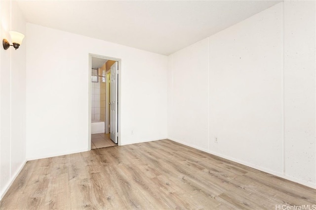 spare room with light hardwood / wood-style floors