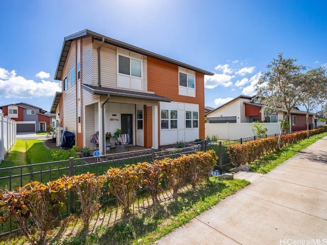 view of front facade with a fenced front yard