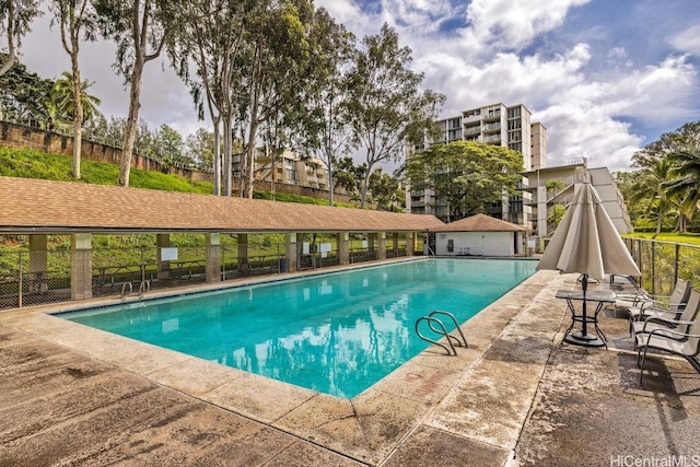 view of swimming pool featuring a patio area