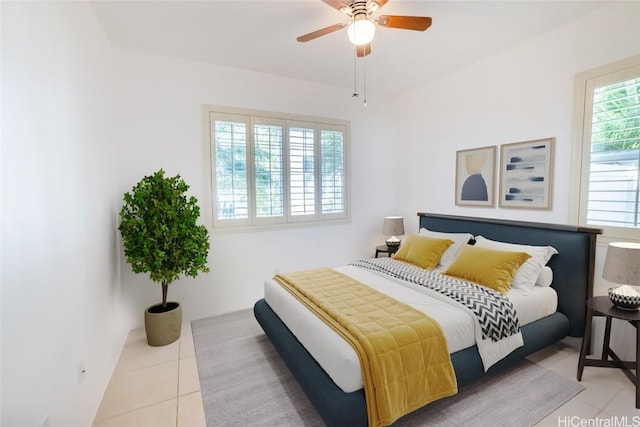 bedroom featuring ceiling fan and light tile patterned floors