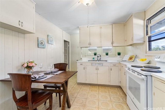 kitchen with sink and white electric range