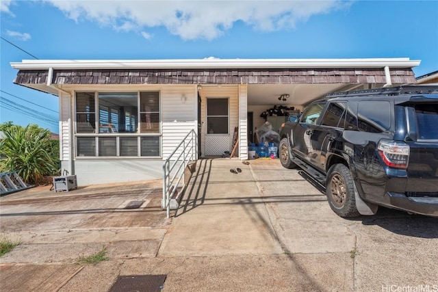 view of front of home featuring a carport