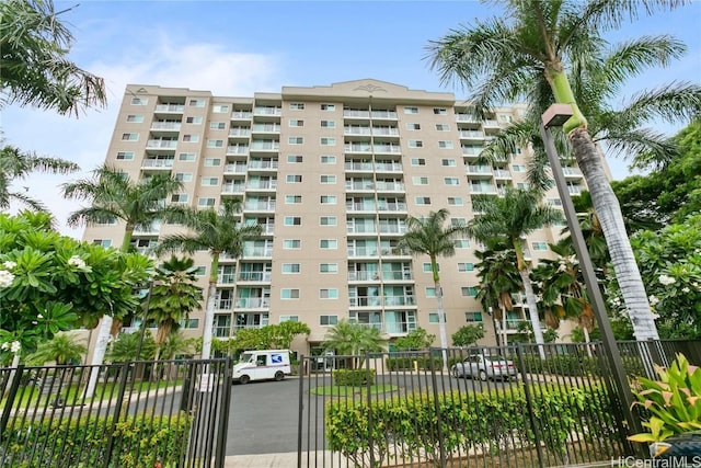 view of building exterior with fence