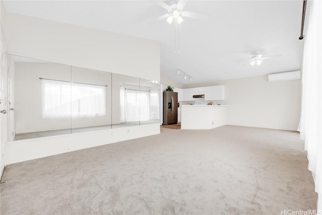 unfurnished living room featuring a wall mounted AC, ceiling fan, and light carpet