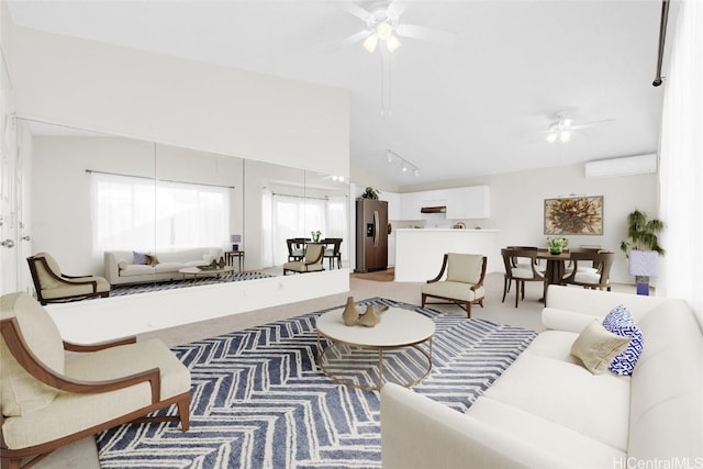 living room featuring ceiling fan, a wall unit AC, and track lighting