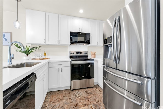 kitchen with black appliances, decorative light fixtures, white cabinets, and sink