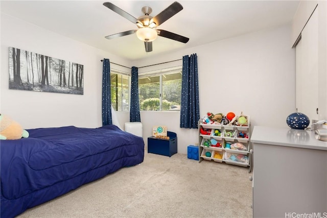 carpeted bedroom with ceiling fan