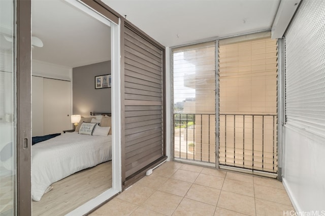 unfurnished bedroom with light tile patterned floors and a closet