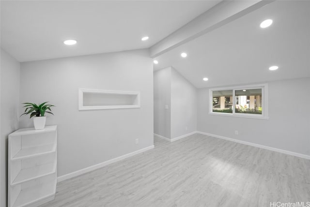 basement with light hardwood / wood-style flooring