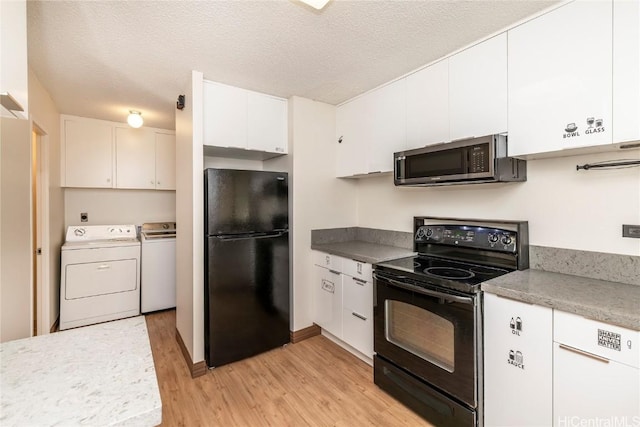 kitchen with washer and clothes dryer, a textured ceiling, white cabinets, and black appliances