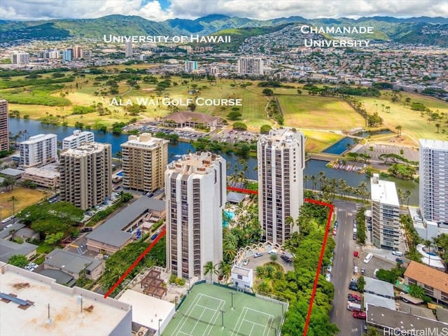 drone / aerial view featuring a water and mountain view