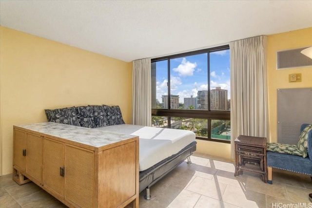 bedroom with light tile patterned flooring