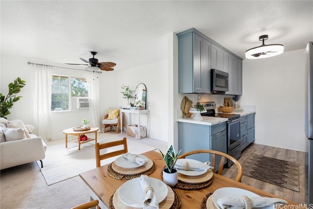 kitchen featuring ceiling fan and appliances with stainless steel finishes