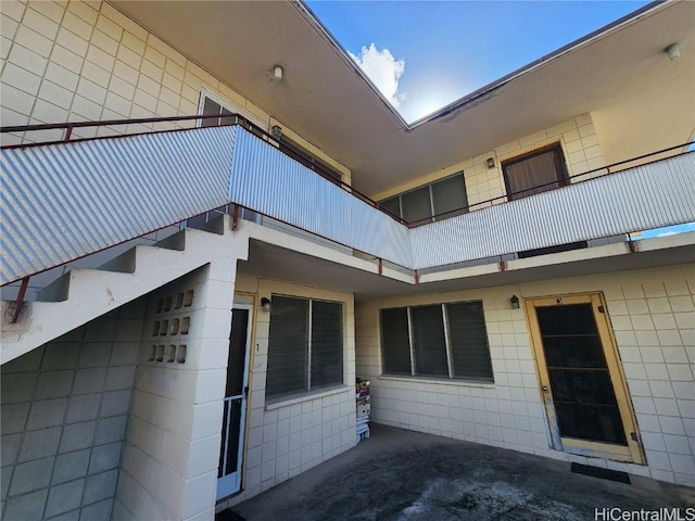 view of property exterior featuring a balcony