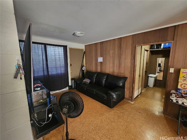 living room featuring wood walls