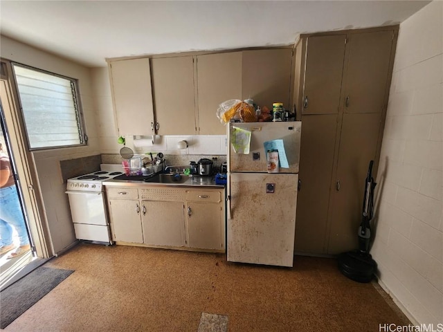 kitchen featuring white appliances and sink