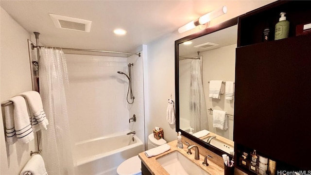 full bathroom with vanity, toilet, and shower / bath combo with shower curtain