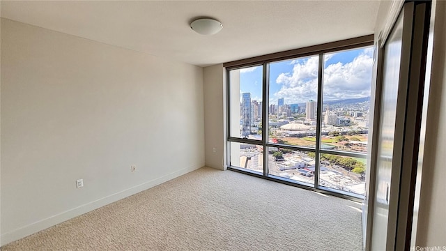 1189 Waimanu St Unit 3107, Honolulu, HI 96814 - spare room with a city view, light carpet, and baseboards