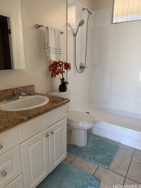 bathroom featuring a shower, toilet, vanity, and tile patterned flooring