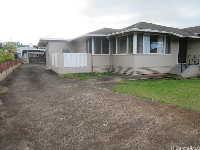 view of property exterior with a carport