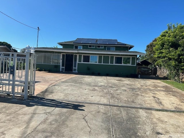 view of front of property with solar panels