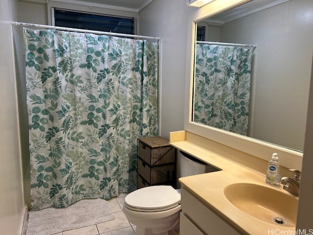 bathroom featuring tile patterned floors, vanity, toilet, and ornamental molding