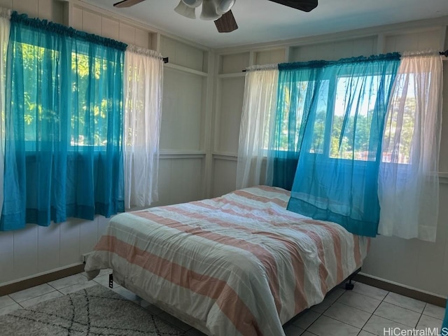 bedroom featuring ceiling fan and light tile patterned flooring