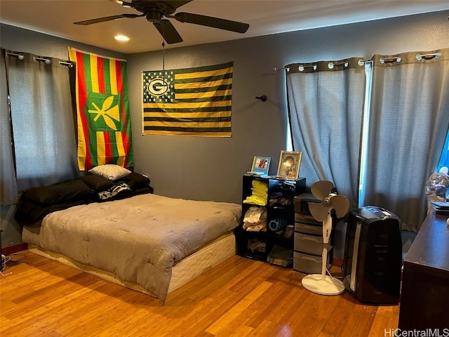 bedroom featuring ceiling fan and hardwood / wood-style flooring