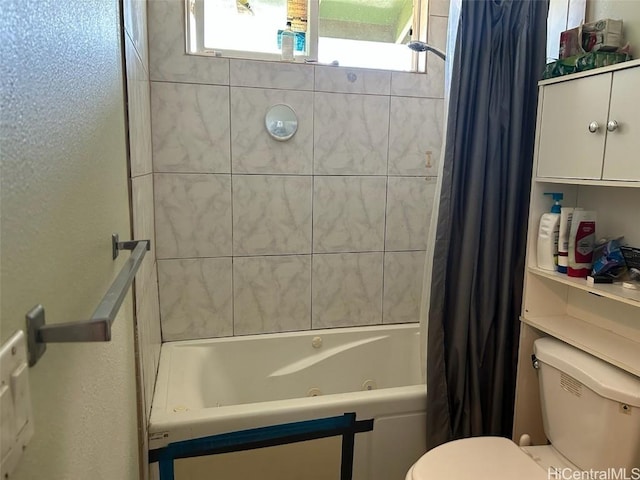 bathroom featuring toilet and shower / tub combo