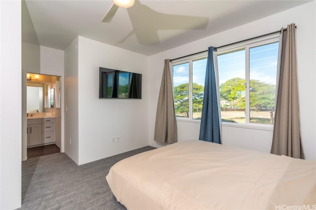 carpeted bedroom featuring ceiling fan and connected bathroom