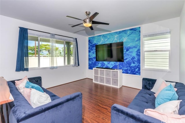 living room with ceiling fan and dark hardwood / wood-style floors