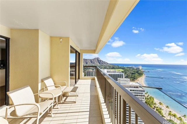 balcony with a view of the beach and a water view