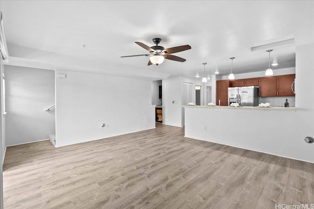 91-1081 Iwikuamoo St Unit 1203, Ewa Beach, HI 96706 - unfurnished living room with a ceiling fan and light wood-style floors