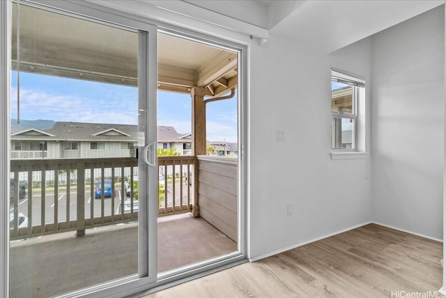 91-1081 Iwikuamoo St Unit 1203, Ewa Beach, HI 96706 - doorway to outside with wood finished floors and a residential view